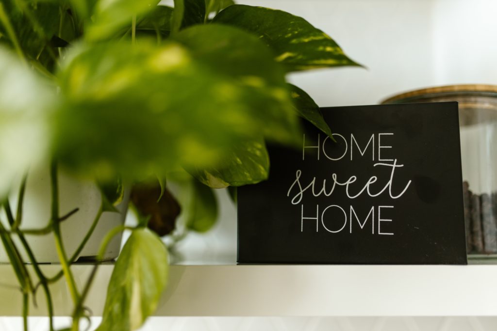 Home Sweet Home sign with plant
